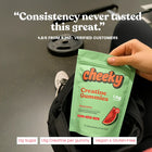 Hand holding Cheeky Creatine Gummies Watermelon pouch at the gym with quote saying “Consistency never tasted this great.”