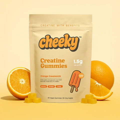 Cheeky Creatine Gummies Orange Creamsicle flavor pouch surrounded by orange slices on yellow background.