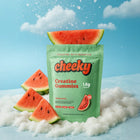 Cheeky Creatine Gummies Watermelon bag on icy clouds with watermelon slices and refreshing blue sky background.
